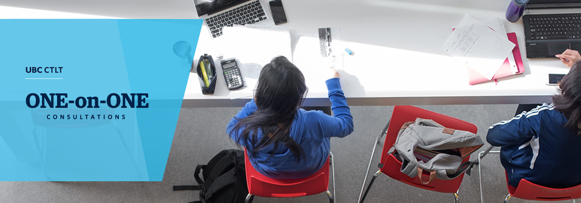 student sitting at white desk working while facing forward