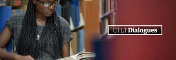 student looking at book